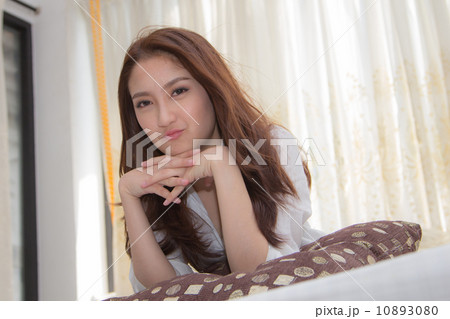 Asian woman in the bedroom. Asian woman in the bedroom. 10893080