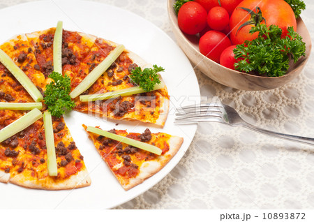 Turkish beef pizza with cucumber on top 10893872