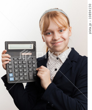 Little blond smiling schoolgirl with calculator above white Little blond smiling schoolgirl with calculator above white 10894150