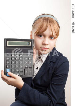 Little blond schoolgirl with calculator above white Little blond schoolgirl with calculator above white 10894151