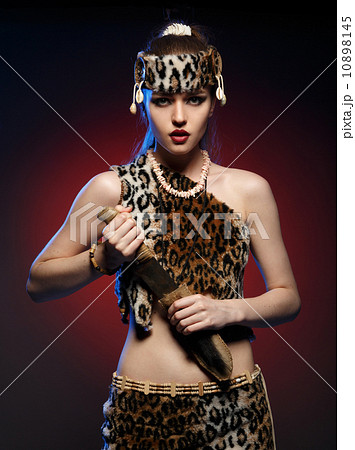 Girl in clothes Amazons with a knife in his hand. 10898145