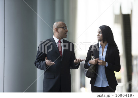 Happy Indian Business colleagues walking outside office. 10904197