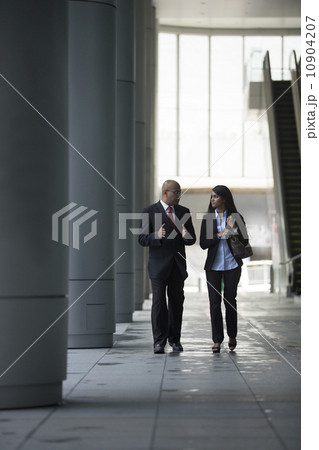Happy Indian Business colleagues walking outside office. Happy Indian Business colleagues walking outside office. 10904207