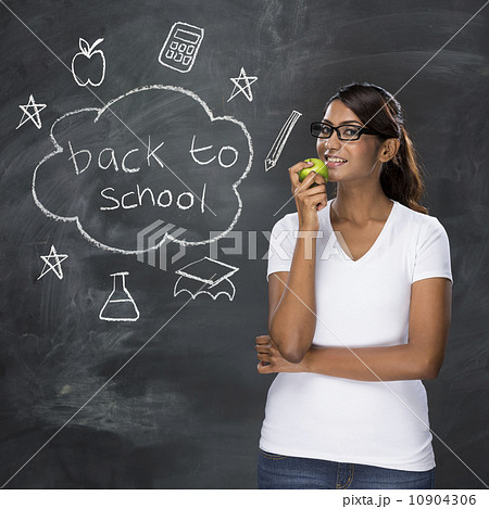 Indian teacher and chalkboard with Back to School concept hand d Indian teacher and chalkboard with Back to School concept hand d 10904306