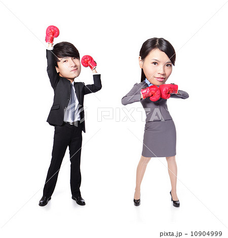Business man and woman win pose with boxing gloves Business man and woman win pose with boxing gloves 10904999