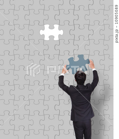 Businessman making a puzzle 10905089