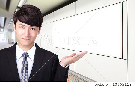 business man shows you empty billboard 10905118