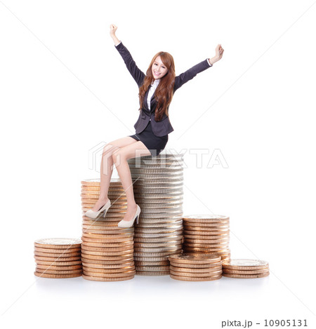 Excited business woman sitting on money 10905131