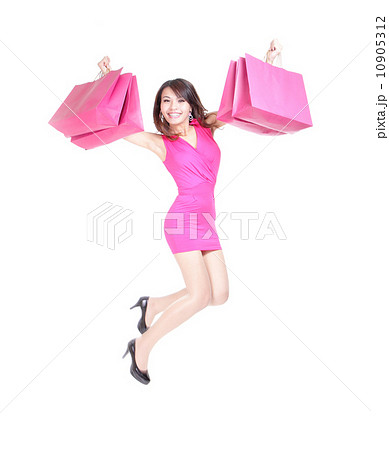 happy shopping young woman jumping 10905312