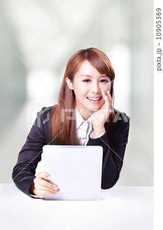 business woman talking and using tablet pc 10905369