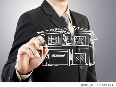 Businessman hand drawing house Businessman hand drawing house 10909353
