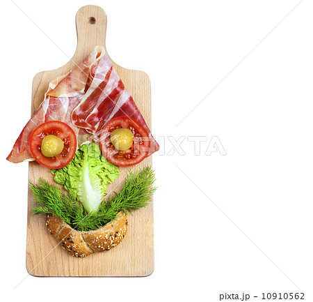 Funny face composition made of vegetables on wooden board, empty 10910562
