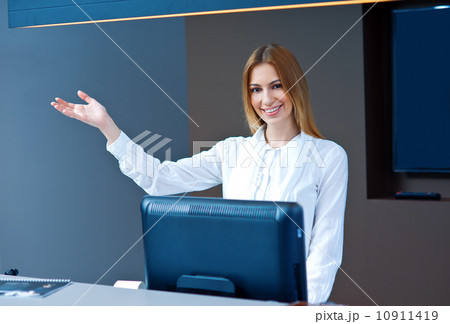 attractive woman receptionist making friendly gesture 10911419