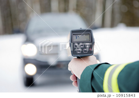 Canada, Alberta, Traffic officer holding speed gun 10915843