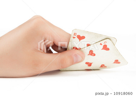 two playing cards in hand isolated on white background 10918060
