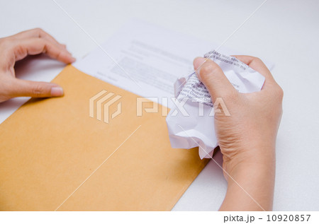 Crumpled paper in hand Crumpled paper in hand 10920857