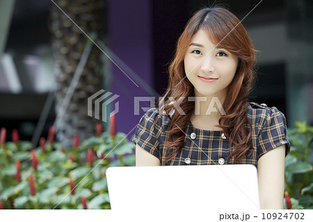 Beautiful businesswoman with laptop 10924702