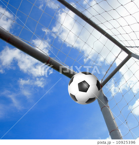 Soccer football in Goal 10925396