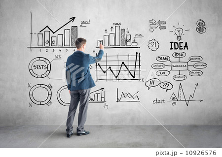 businessman drawing  business plan, graph, chart on wall 10926576