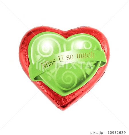 Wrapped red chocolate hearts on white background Wrapped red chocolate hearts on white background 10932629
