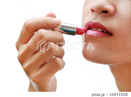 beautiful woman is applying her lips with pink lipstick beautiful woman is applying her lips with pink lipstick 10933308
