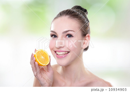 Beautiful woman face with orange 10934903