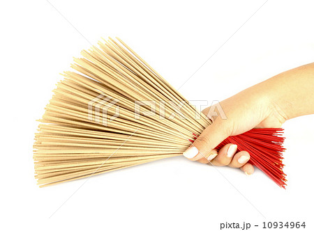 hand holding incense on white background 10934964