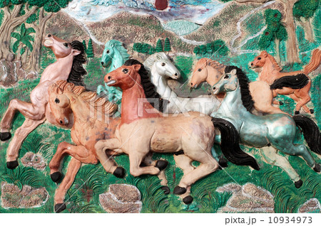 Stone sculpture of horse on wall in Thailand Stone sculpture of horse on wall in Thailand 10934973