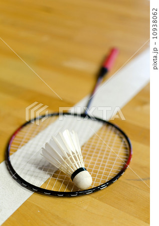 Shuttlecock on badminton racket 10938062
