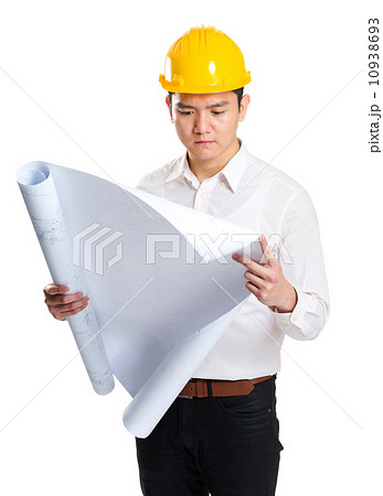Engineer looking at blueprint Engineer looking at blueprint 10938693