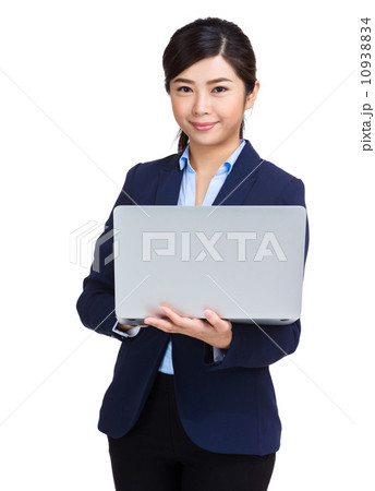 Businesswoman holding computer 10938834
