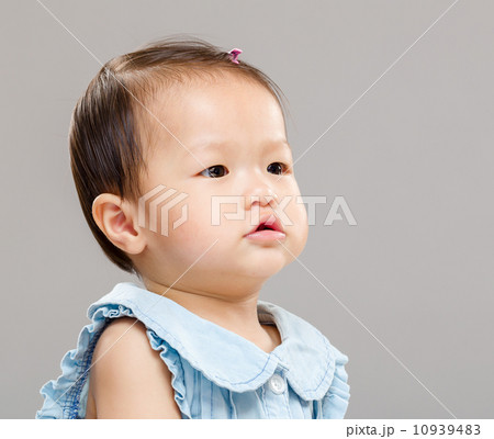 Baby girl looking at aside Baby girl looking at aside 10939483