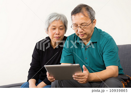 Asia couple using tablet at home Asia couple using tablet at home 10939865