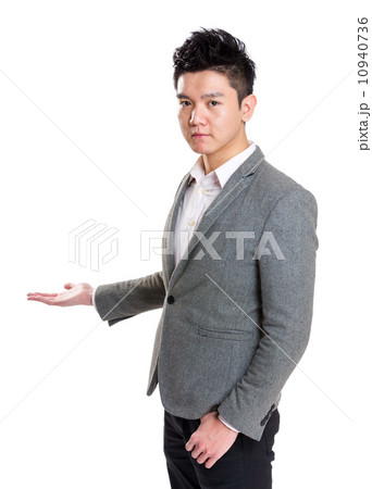 Young businessman hand showing something 10940736