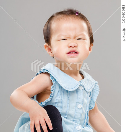 Baby girl making funny face 10940993