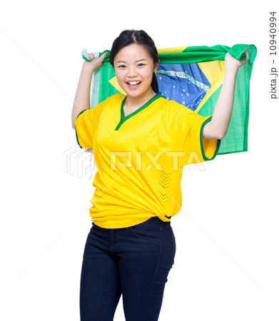 Asia female soccer fans holding Brazil flag 10940994