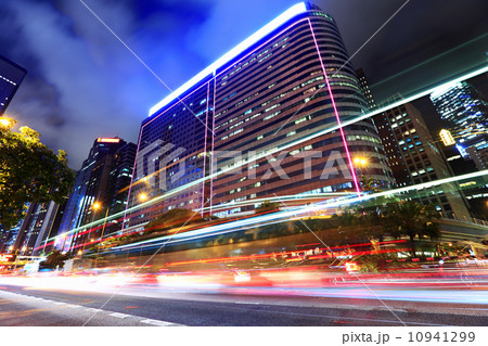 Car light through city at night 10941299