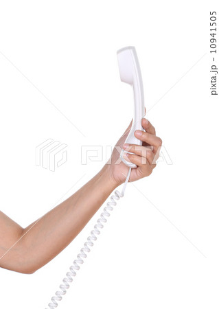 Hand holding white telephone tube Hand holding white telephone tube 10941505