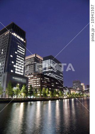 The city lights of Tokyo reflect off of the water The city lights of Tokyo reflect off of the water 10941507