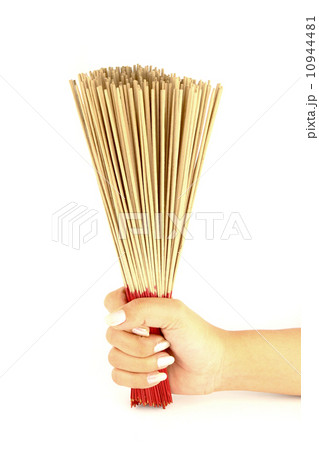 hand holding incense on white background 10944481