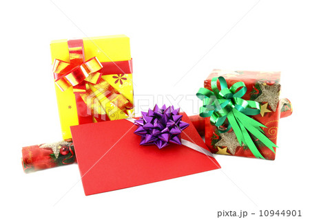 Gift box and roll paper with gift card on white background Gift box and roll paper with gift card on white background 10944901