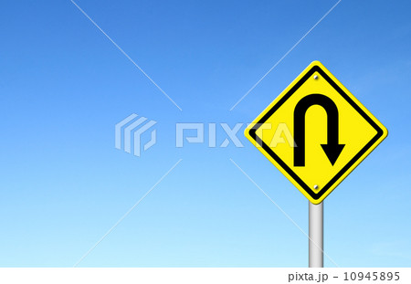 Yellow warning sign u-turn roadsign with blue sky background 10945895