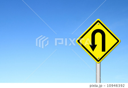 Yellow warning sign u-turn roadsign with blue sky background 10946392