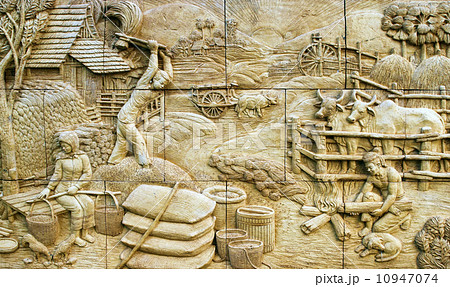 native culture Thai stucco on the stone wall, Thailand 10947074