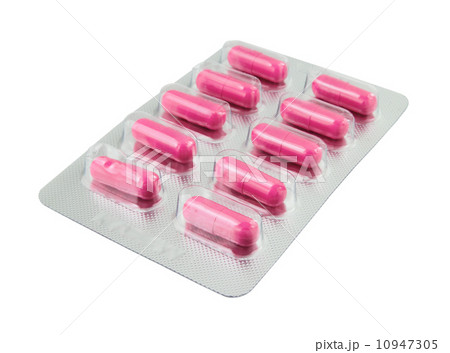 Pink pills pack on white 10947305