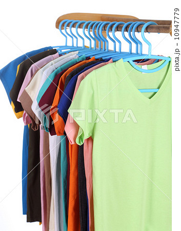 t-shirts hanging on hangers 10947779