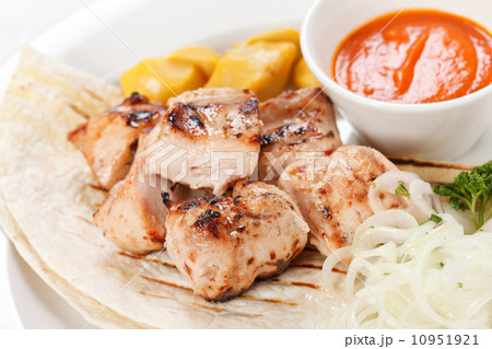 chicken with tortilla and sauce chicken with tortilla and sauce 10951921