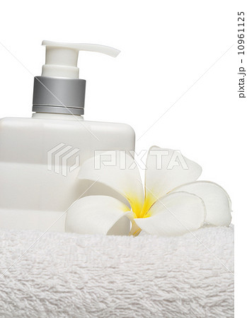 square bottle soap and flower on white towel white background square bottle soap and flower on white towel white background 10961125
