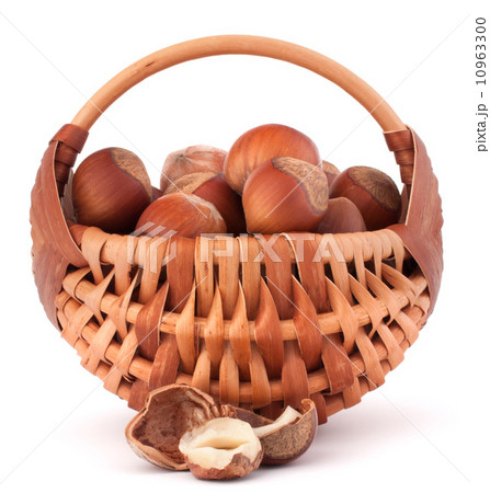 Hazelnuts in wicker basket 10963300