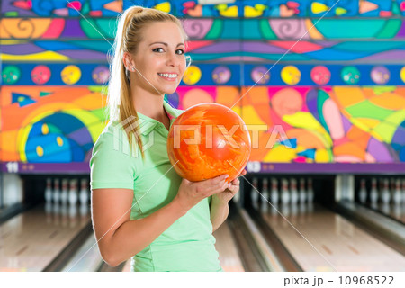Young woman bowling having fun Young woman bowling having fun 10968522